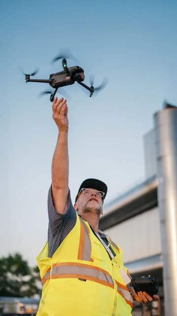 Michael Warf, founder of Lethbridge Drone, holding a drone controller.